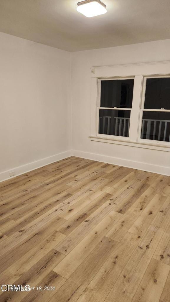 spare room featuring light hardwood / wood-style floors