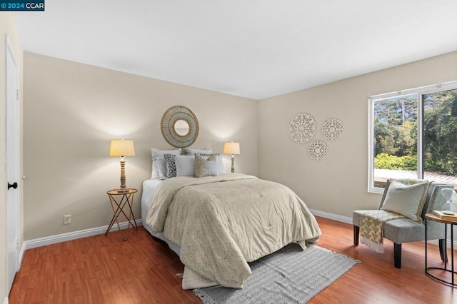 bedroom featuring hardwood / wood-style floors