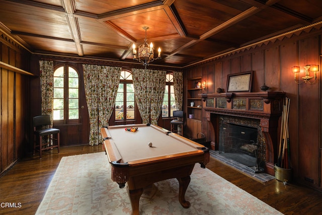 rec room with billiards, wood walls, dark hardwood / wood-style flooring, wooden ceiling, and an inviting chandelier