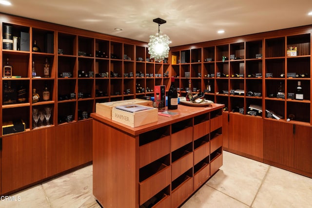 wine area featuring an inviting chandelier