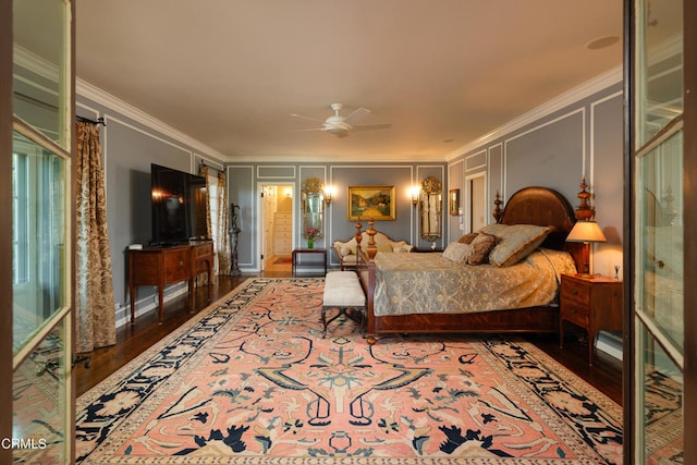 bedroom with crown molding, hardwood / wood-style floors, and ceiling fan