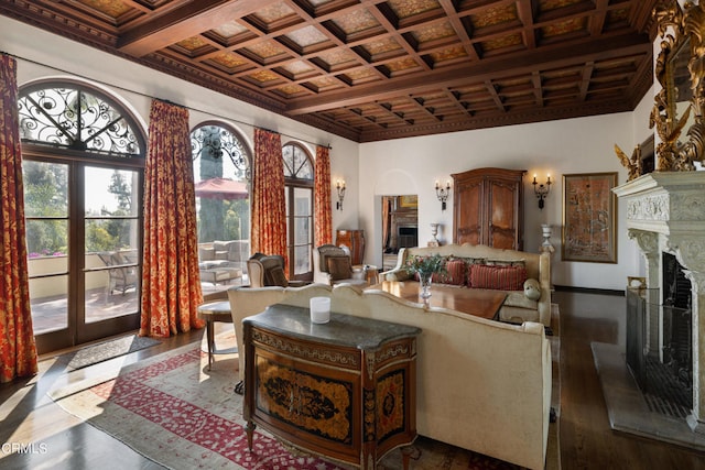 living room with wood-type flooring, coffered ceiling, and ornamental molding