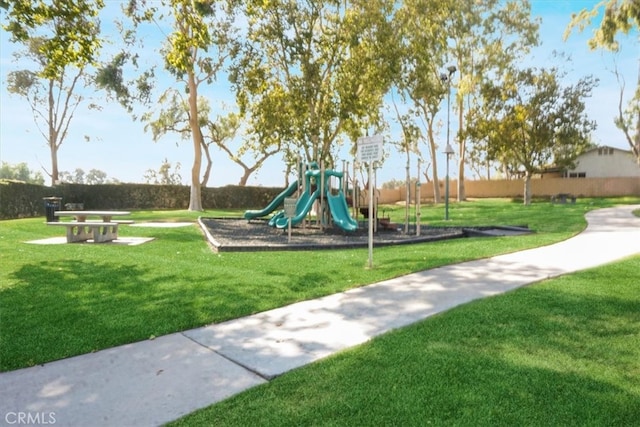 view of playground with a yard