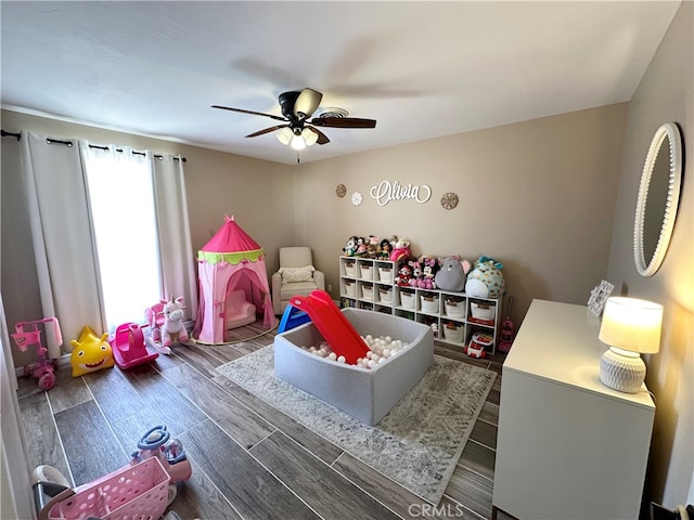 bedroom with ceiling fan and dark hardwood / wood-style floors