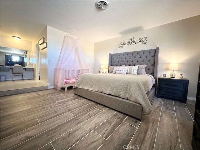 bedroom featuring hardwood / wood-style flooring