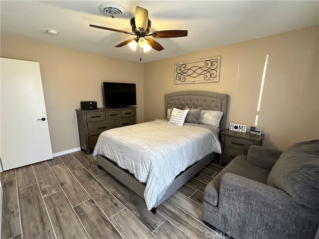 bedroom featuring ceiling fan and dark hardwood / wood-style floors