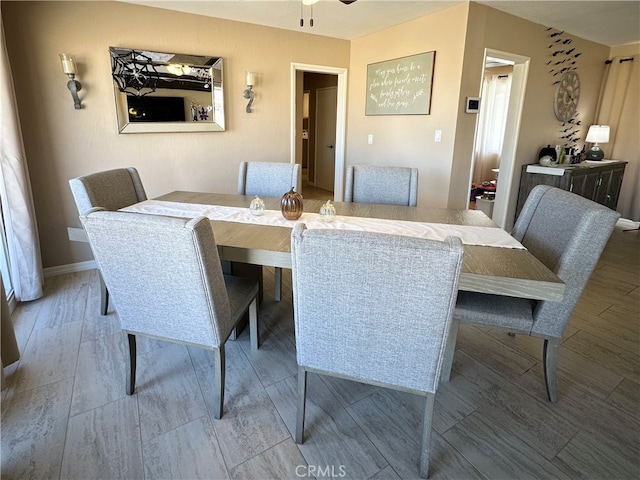 dining space featuring ceiling fan and hardwood / wood-style floors