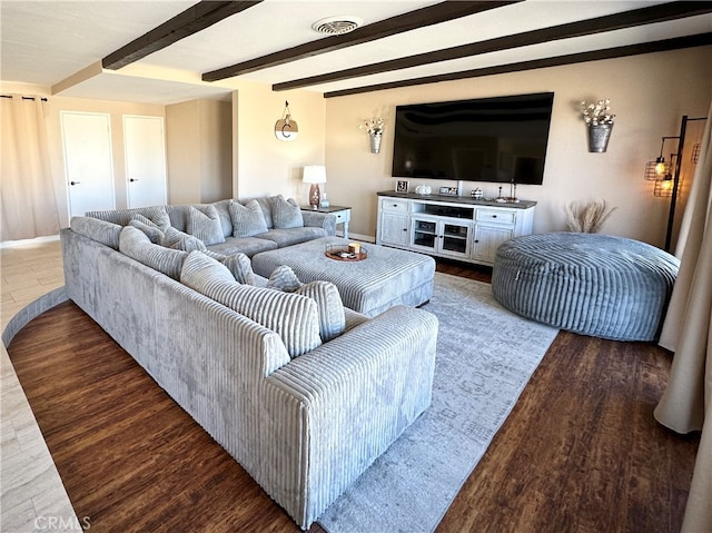 living room featuring hardwood / wood-style floors and beam ceiling