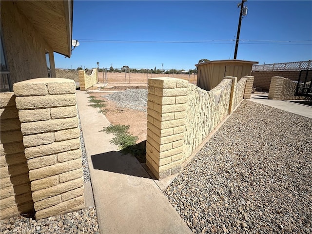 exterior space featuring a storage shed