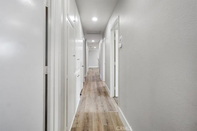 corridor featuring light hardwood / wood-style flooring