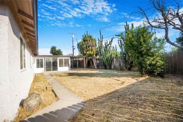 view of yard featuring a sunroom