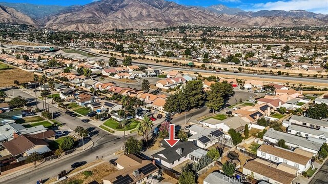 drone / aerial view featuring a mountain view