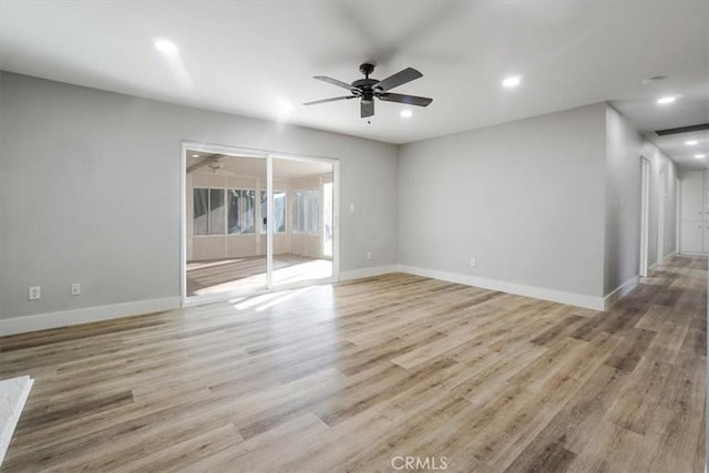 spare room with light hardwood / wood-style floors and ceiling fan