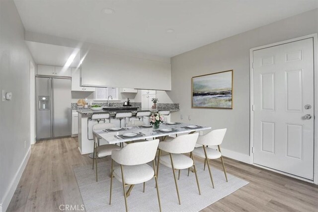 dining space featuring light hardwood / wood-style floors