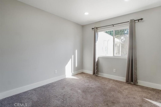 unfurnished room with carpet flooring