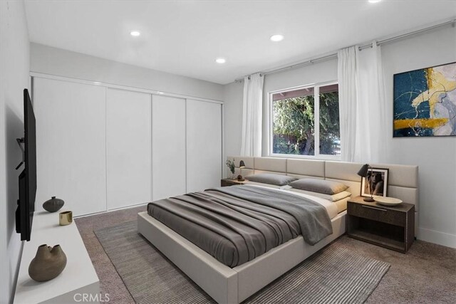 carpeted bedroom featuring a closet