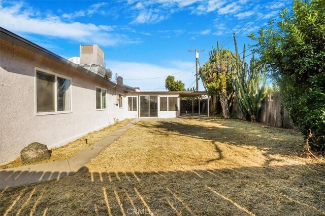 view of yard featuring a sunroom