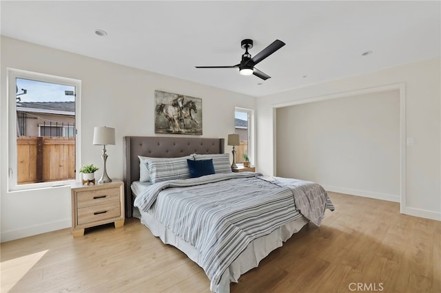 bedroom with light wood-type flooring and ceiling fan