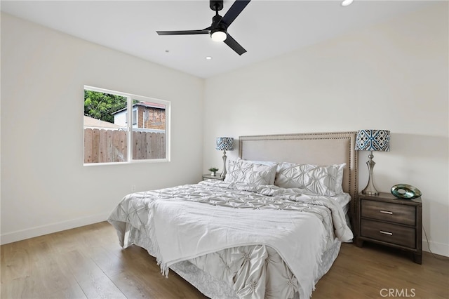 bedroom featuring ceiling fan and hardwood / wood-style flooring