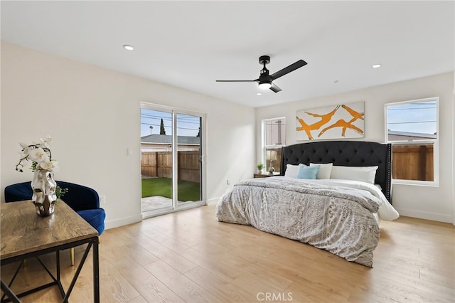 bedroom featuring light wood-type flooring, ceiling fan, and access to outside