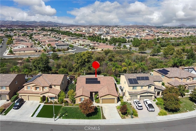 birds eye view of property with a mountain view