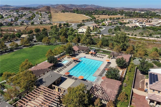 birds eye view of property with a mountain view