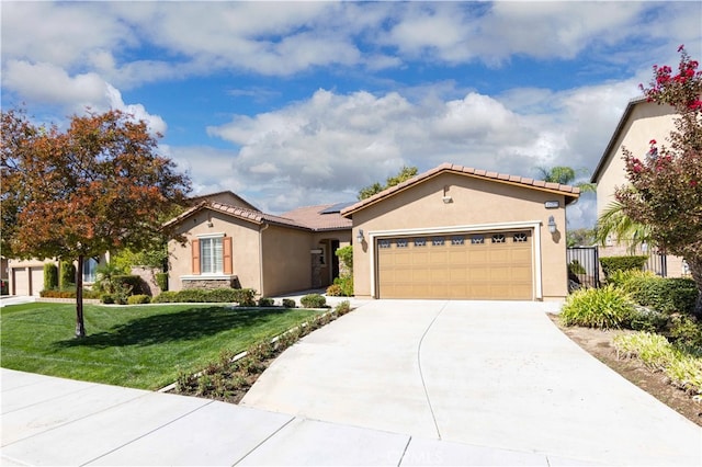 view of front of home with a front lawn and a garage