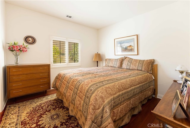 bedroom featuring dark hardwood / wood-style flooring