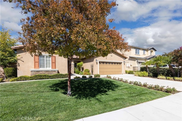 view of front of property with a front yard and a garage