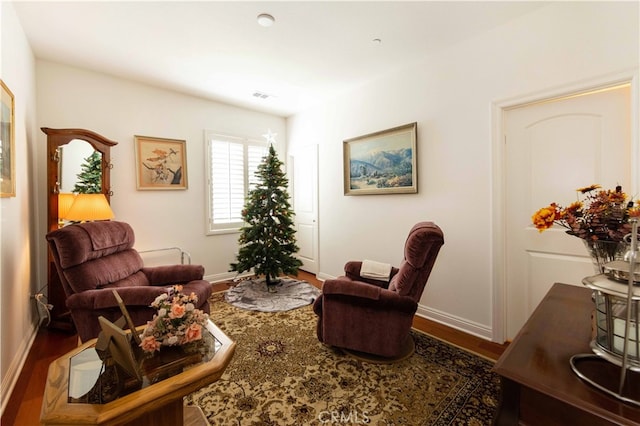 sitting room featuring hardwood / wood-style flooring