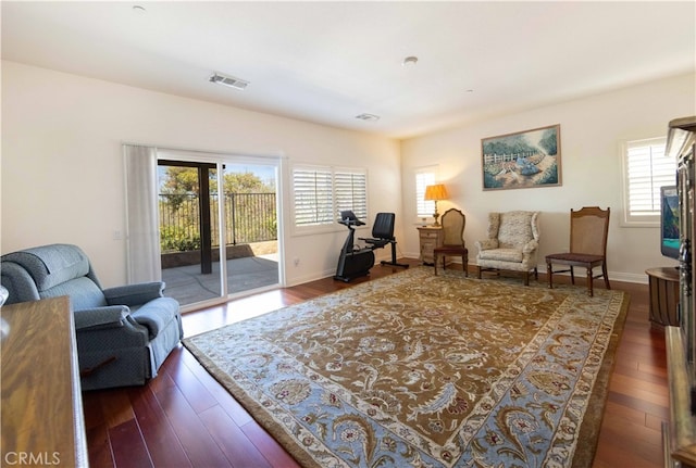 living room with dark hardwood / wood-style flooring