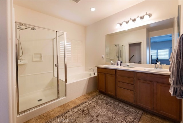 bathroom featuring vanity and separate shower and tub