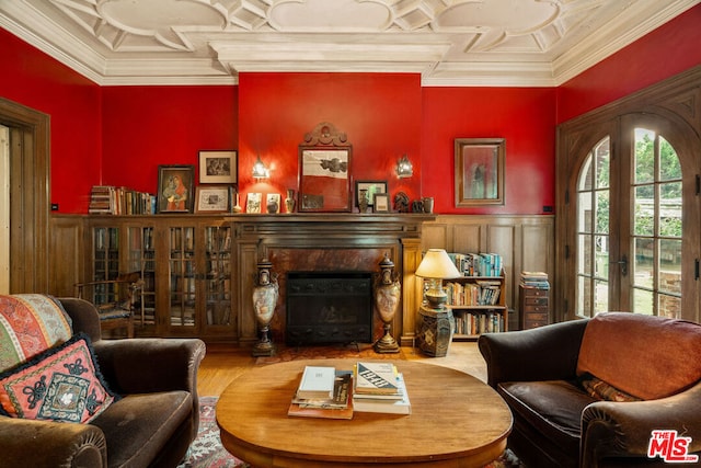 living room with hardwood / wood-style floors, french doors, and crown molding