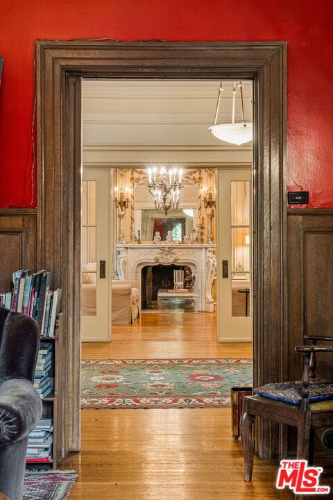 living room with crown molding and hardwood / wood-style floors