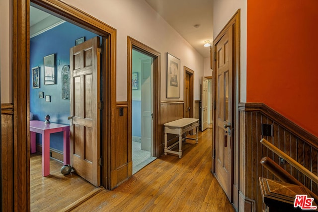 corridor with light wood-type flooring