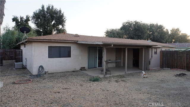 rear view of house with a patio