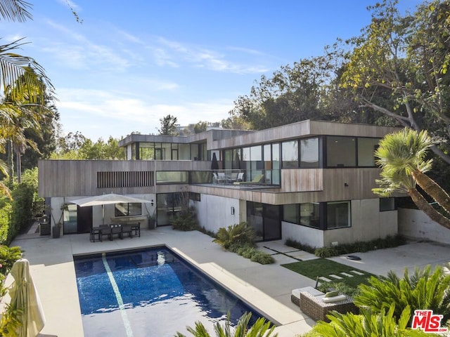 view of swimming pool featuring a patio area