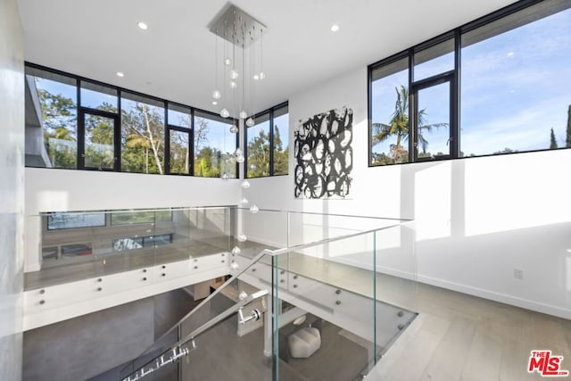 interior space featuring light hardwood / wood-style flooring and pendant lighting