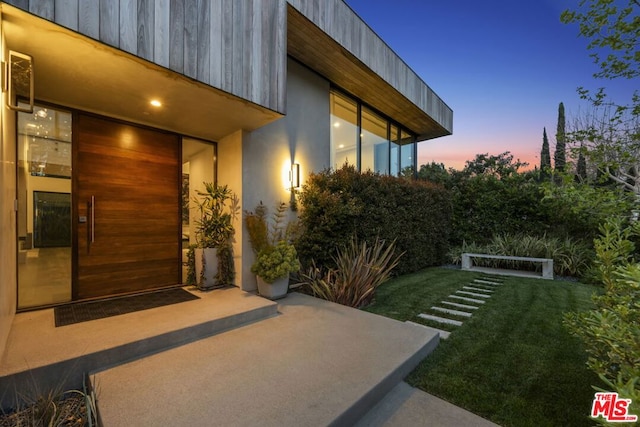 patio terrace at dusk with a yard