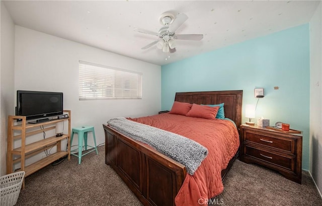 bedroom featuring ceiling fan and dark carpet