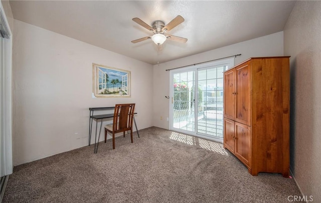 office area with ceiling fan and carpet floors