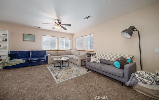 carpeted living room featuring ceiling fan