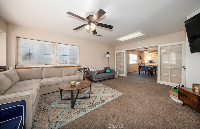 living room with carpet flooring, french doors, and ceiling fan