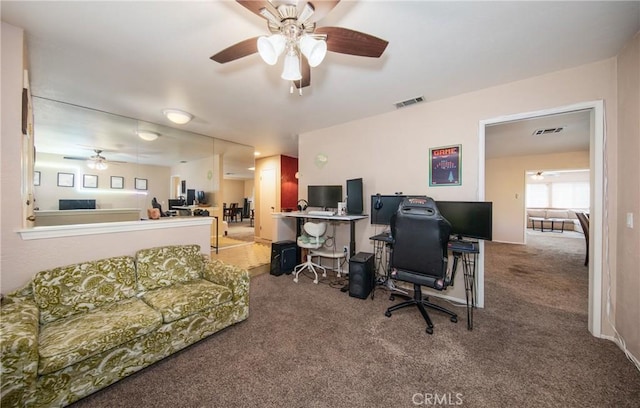 carpeted home office with ceiling fan