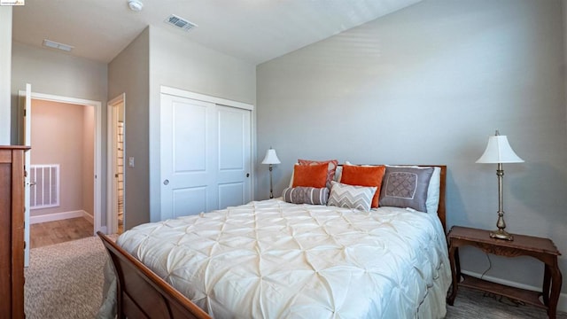 bedroom featuring a closet and hardwood / wood-style flooring