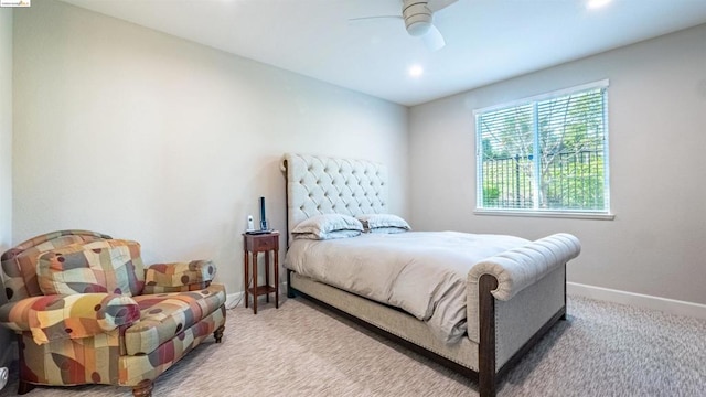 bedroom with ceiling fan and light colored carpet