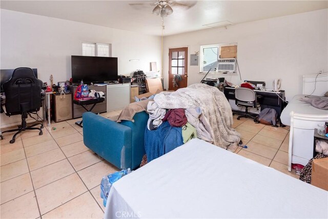 bedroom with light tile patterned floors and ceiling fan