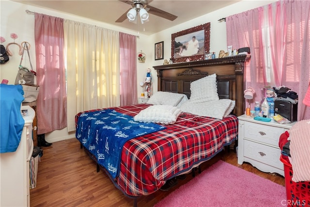 bedroom featuring wood-type flooring and ceiling fan