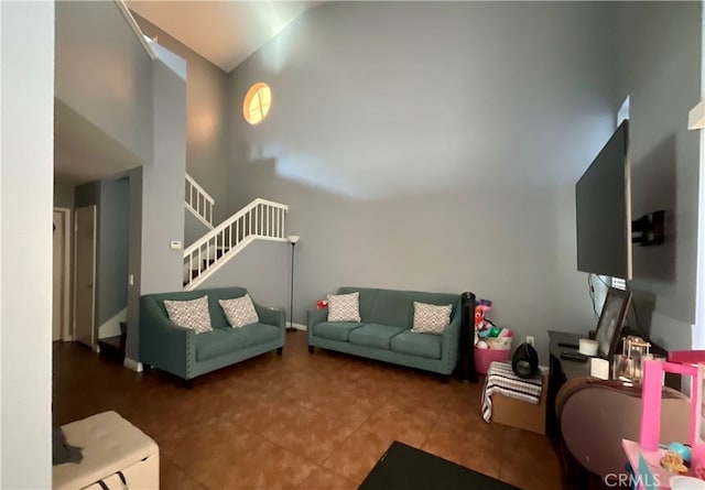 living room with high vaulted ceiling