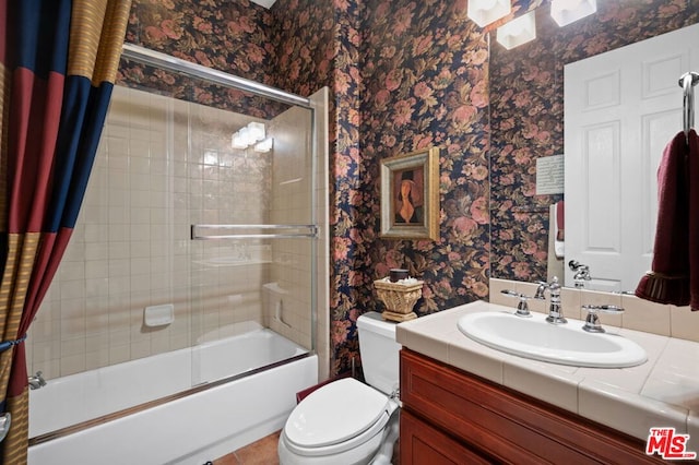 full bathroom with shower / bath combination with curtain, vanity, and toilet